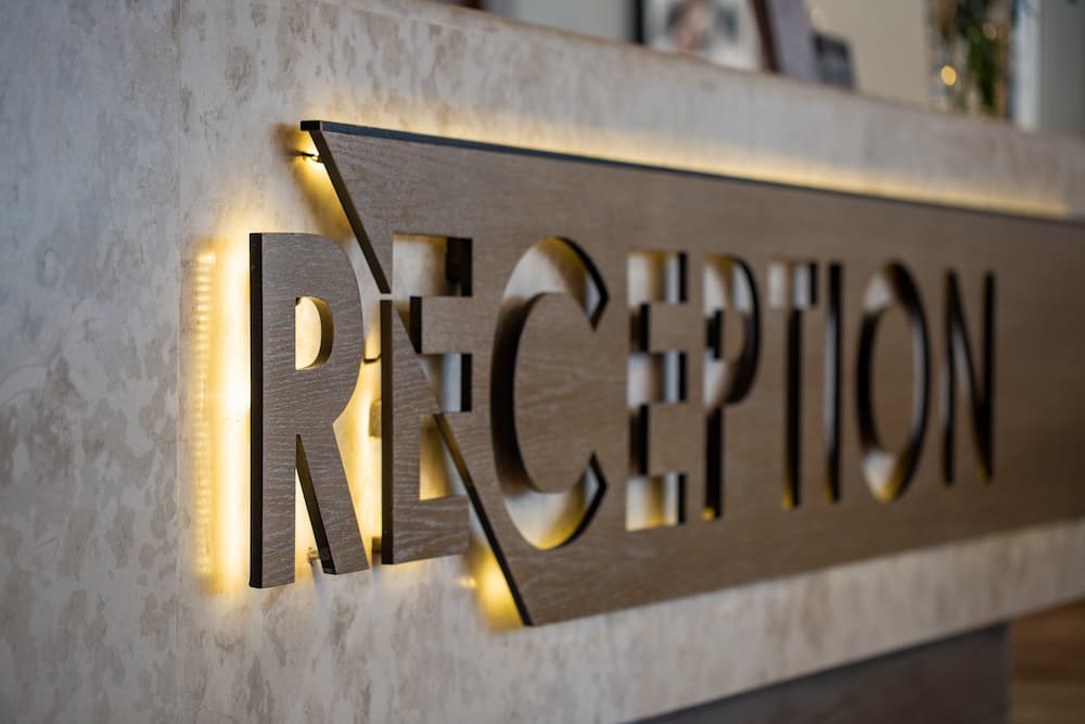 The reception sign on the desk in a business